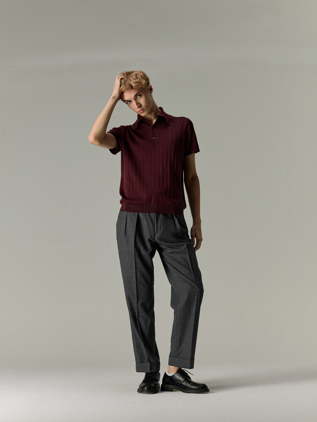 Burgundy — The Classic Polo, styled with grey pleated trousers